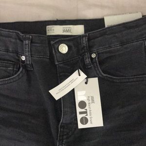 Topshop Jamie high waist jeans in washed black.